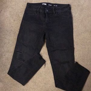 Black over washed cutoff ankle jeans from Vans